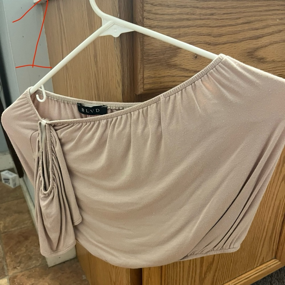 Pink top with off the shoulder sleeve
